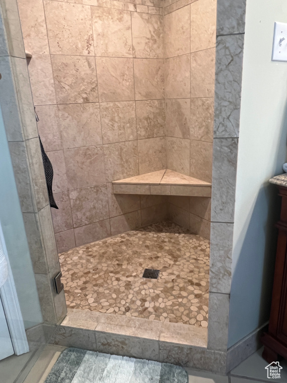 Bathroom with vanity and a stall shower