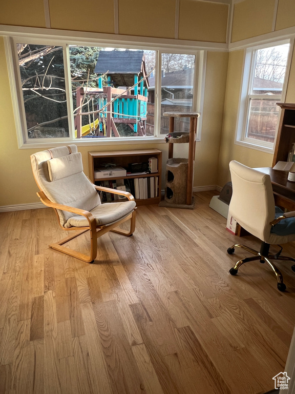 Living area featuring wood finished floors and baseboards