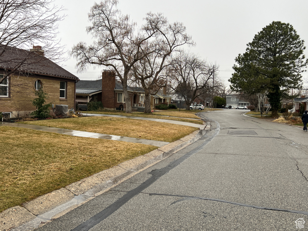 View of road featuring a residential view and curbs