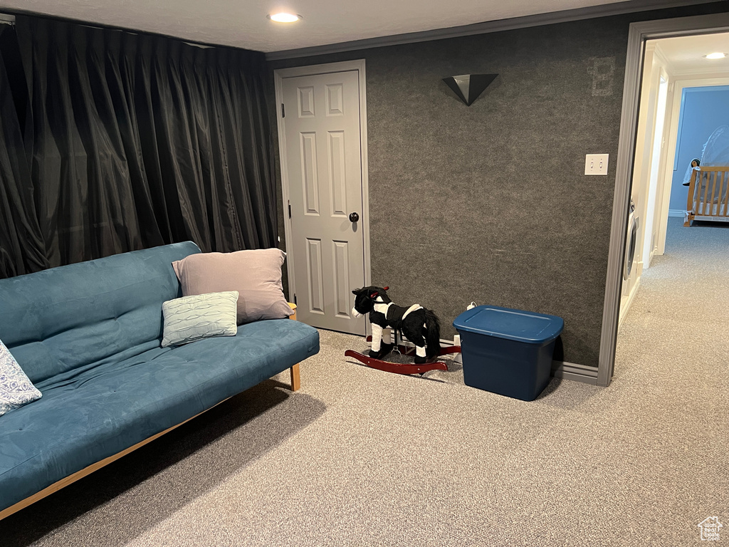 Sitting room with recessed lighting and carpet floors