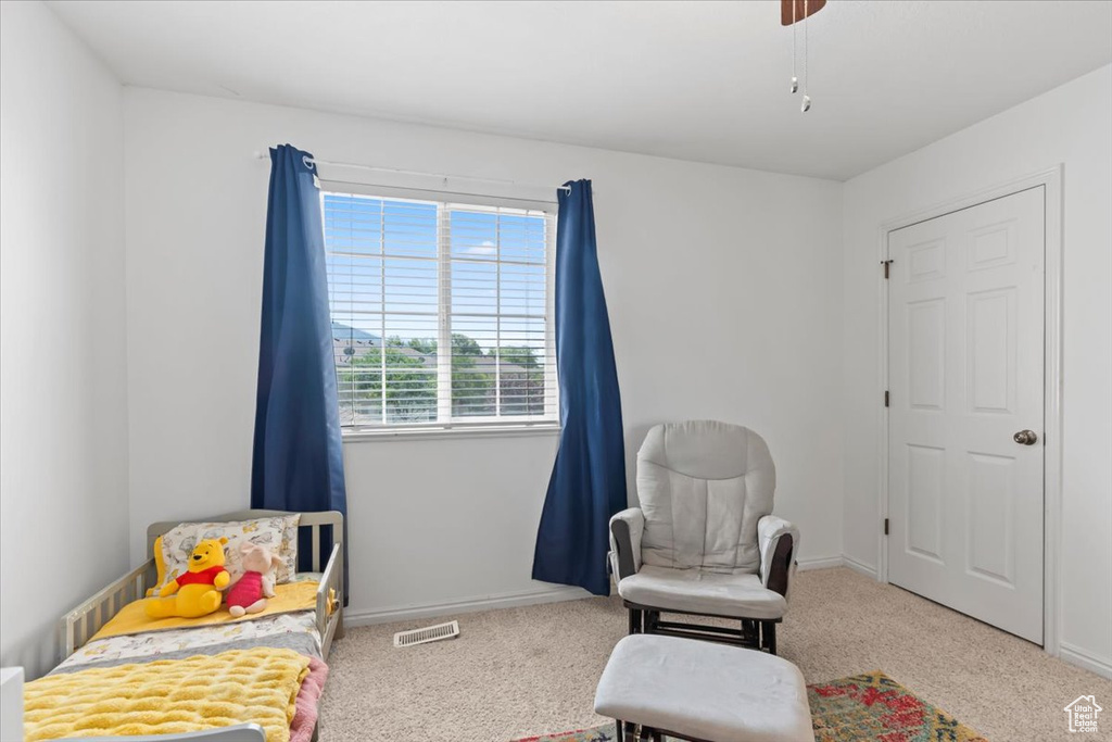 Bedroom featuring carpet flooring and a ceiling fan