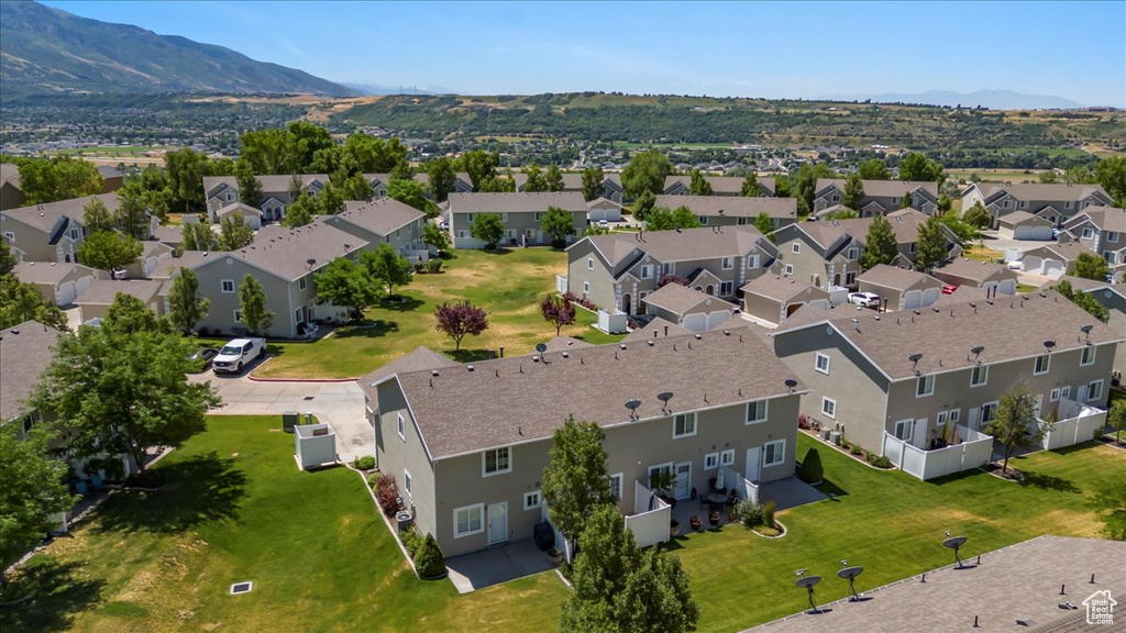 Birds eye view of property with a residential view and a mountain view