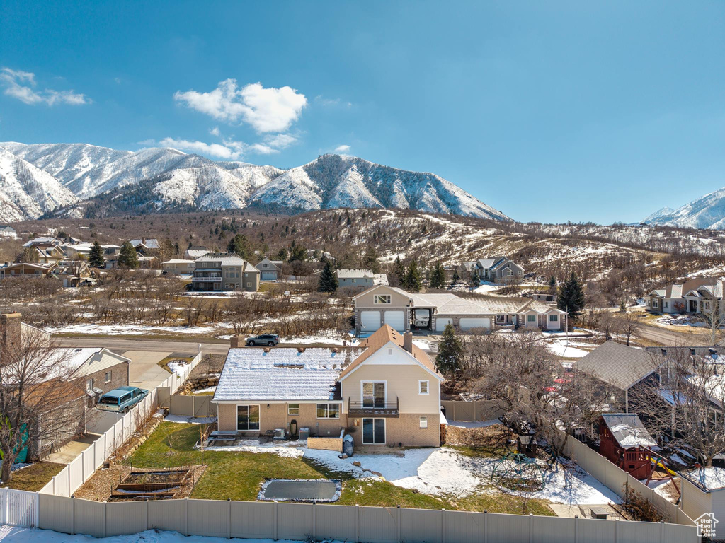 Property view of mountains with a residential view