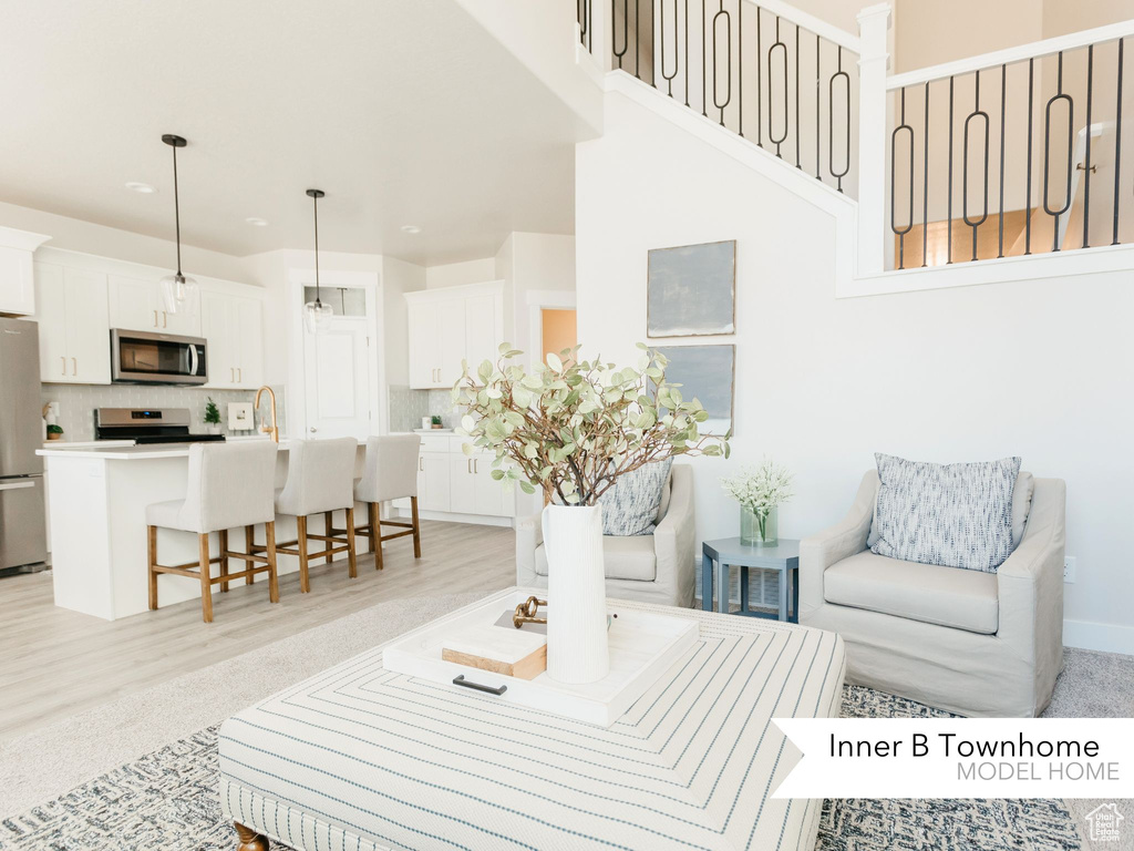 Living room featuring baseboards and light wood-style floors