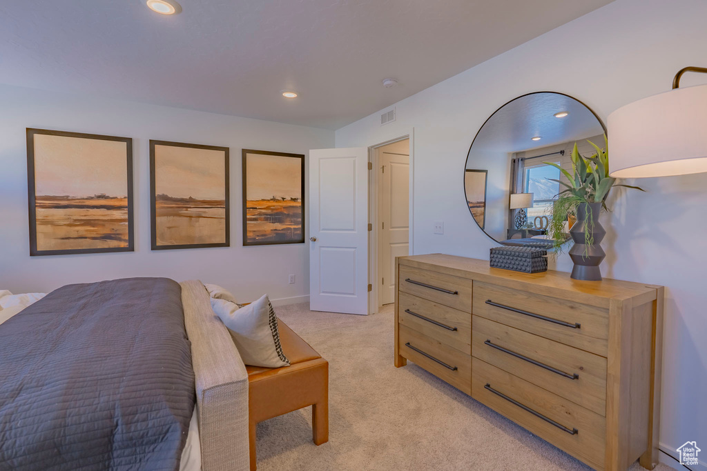Bedroom with recessed lighting, visible vents, and light colored carpet