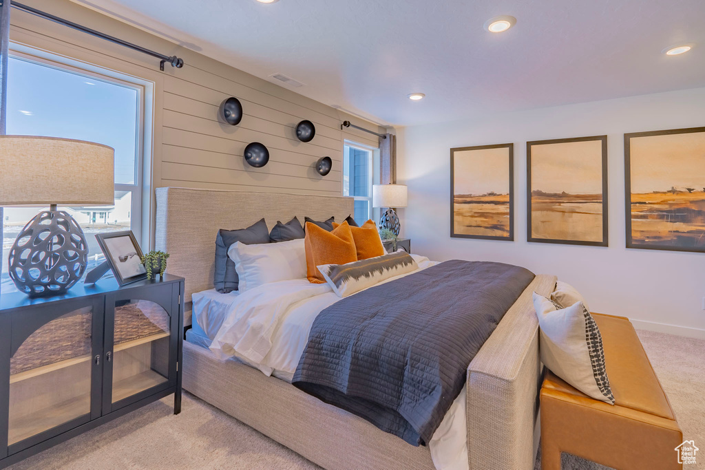 Bedroom with carpet floors, recessed lighting, visible vents, and baseboards