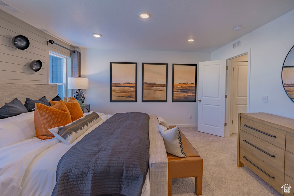 Bedroom with recessed lighting, visible vents, and light colored carpet