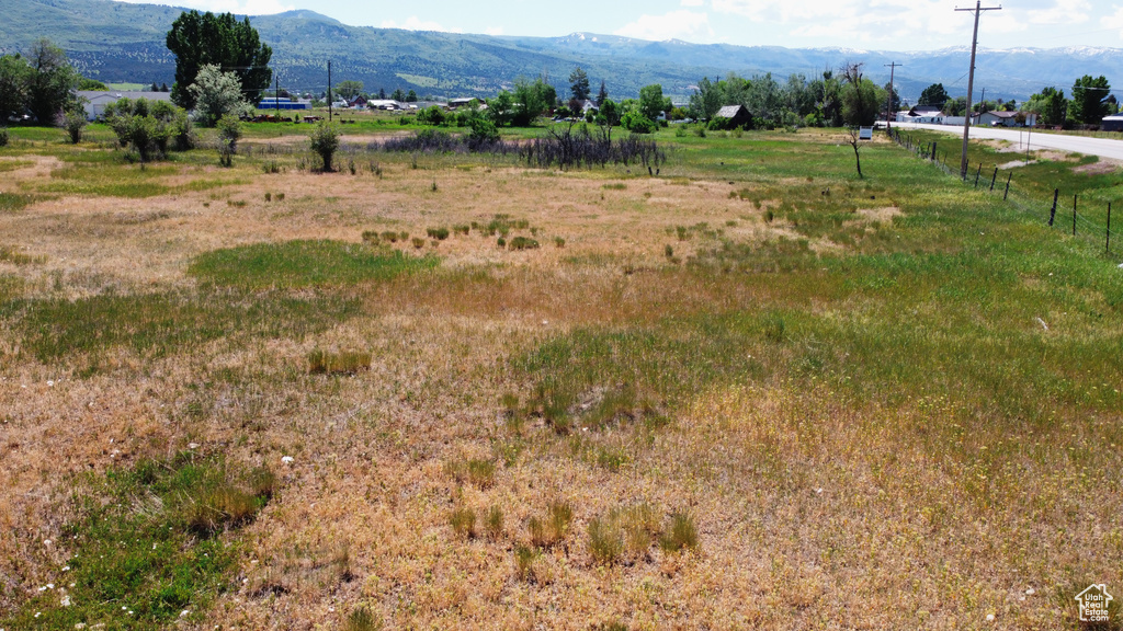 View of mountain backdrop featuring rural landscape