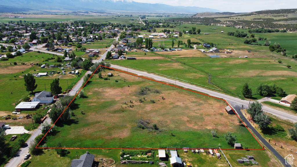Aerial view of sparsely populated area featuring property boundaries highlighted