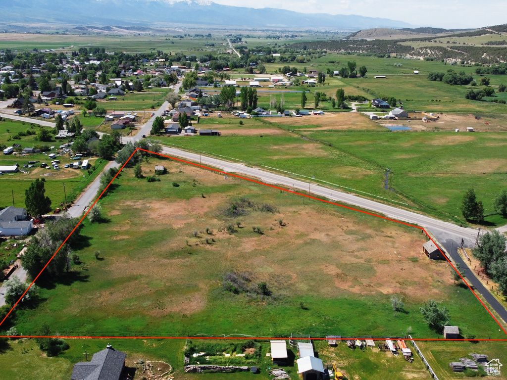 Aerial view of sparsely populated area featuring property boundaries highlighted