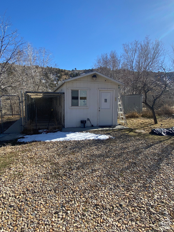 View of outdoor structure featuring an outbuilding