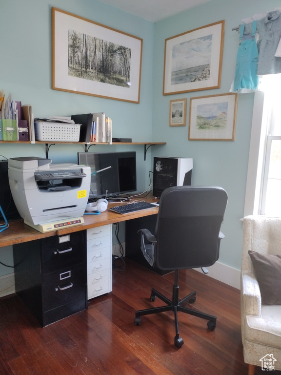 Office with baseboards and dark wood-style flooring