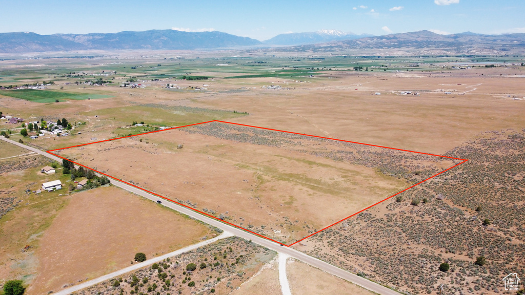 View of rural area featuring property parcel outlined and a mountain backdrop