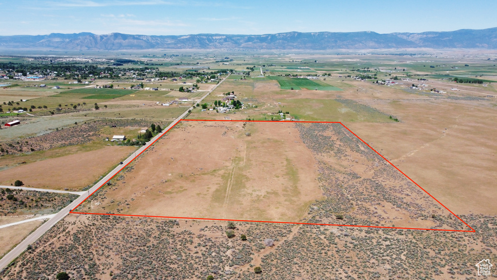 View of rural area featuring property parcel outlined and mountains