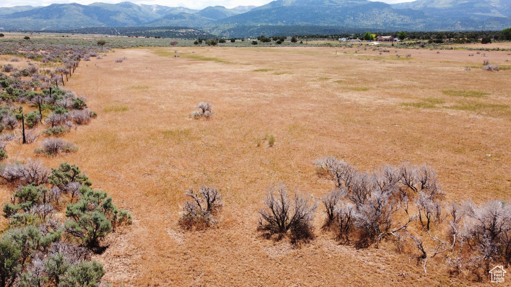 Overview of rural landscape featuring a mountain backdrop