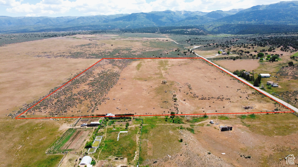 View of rural area featuring property parcel outlined and a mountain backdrop