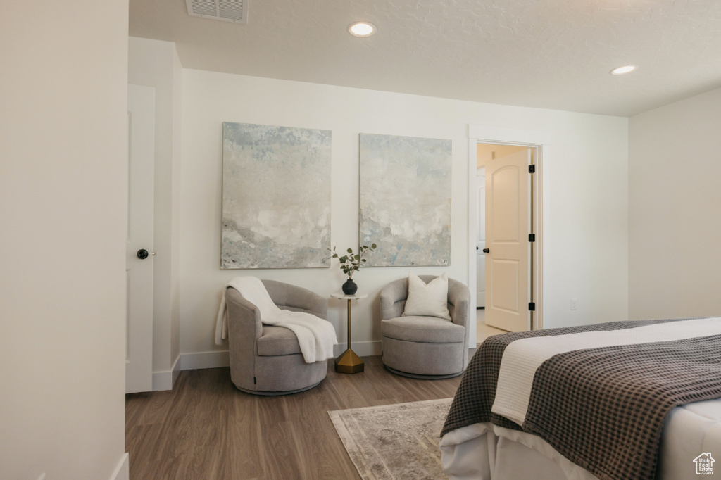 Bedroom featuring visible vents, recessed lighting, baseboards, and wood finished floors