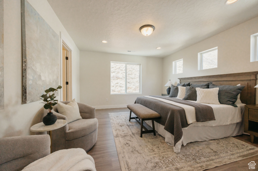 Bedroom featuring recessed lighting, baseboards, and wood finished floors