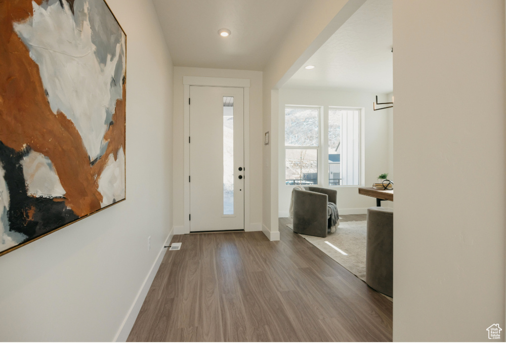 Entrance foyer featuring recessed lighting, baseboards, and wood finished floors
