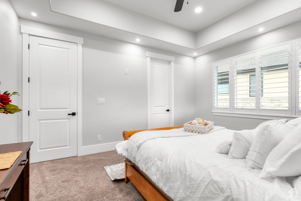 Carpeted bedroom with recessed lighting, a ceiling fan, and baseboards