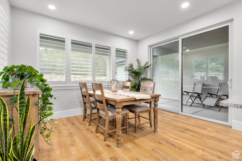 Dining room with recessed lighting and light wood-style floors