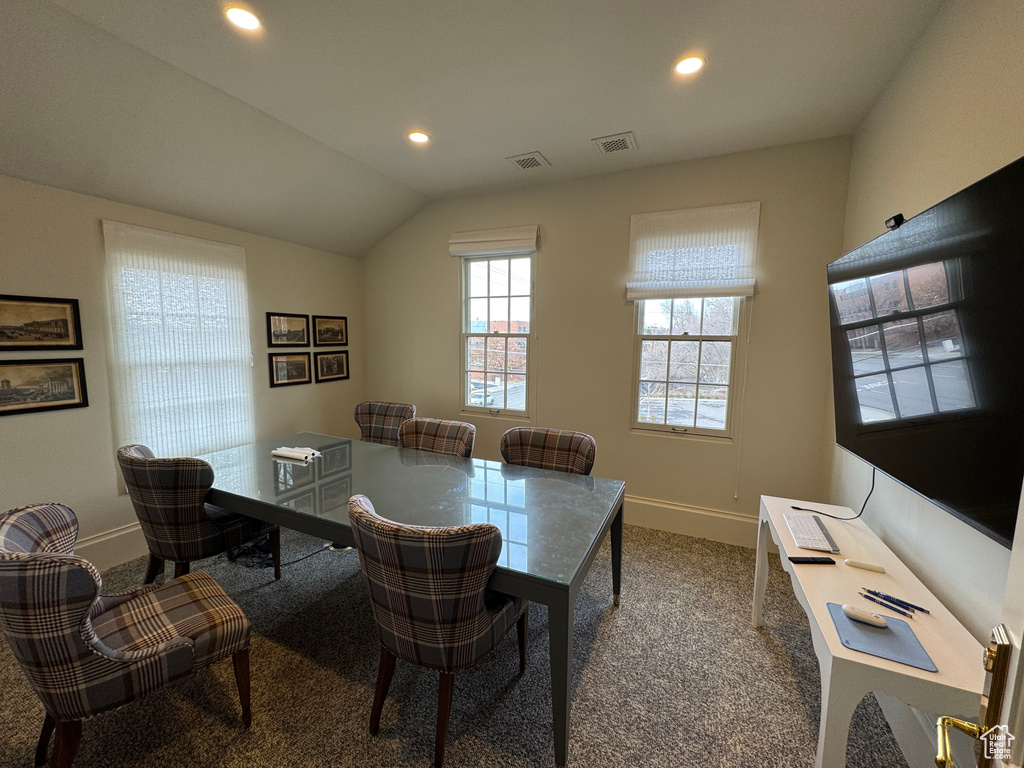 Dining space featuring vaulted ceiling, recessed lighting, baseboards, and carpet floors