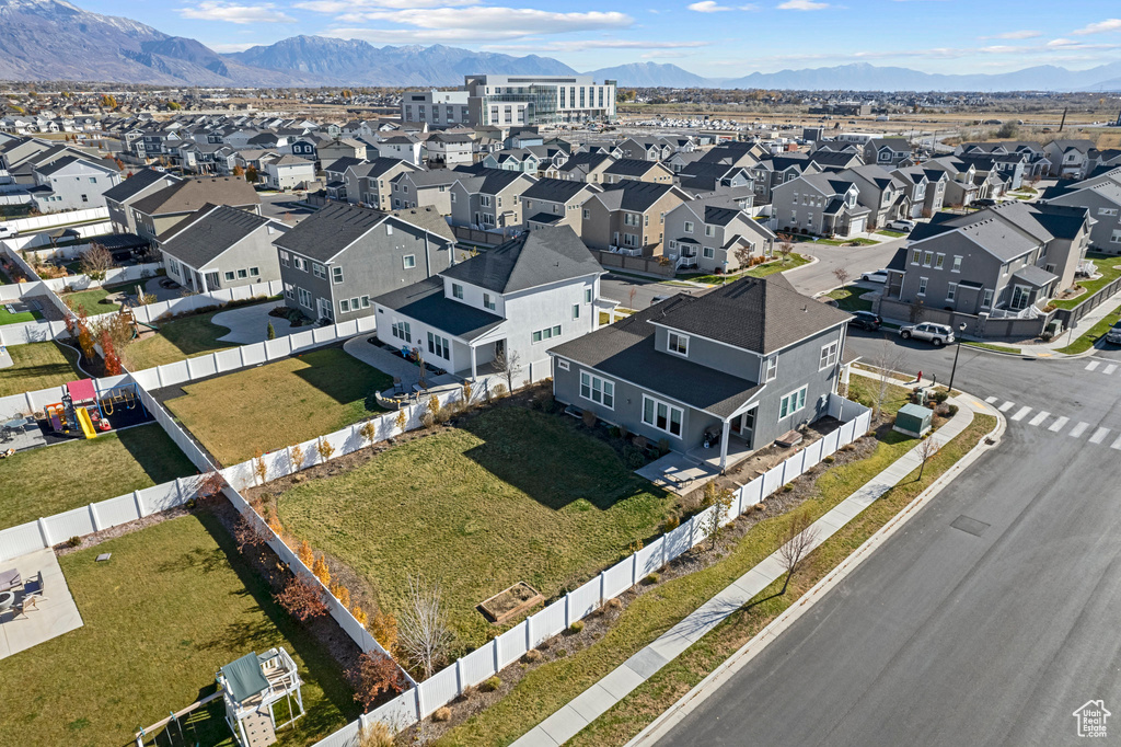 Birds eye view of property featuring a mountain view and a residential view