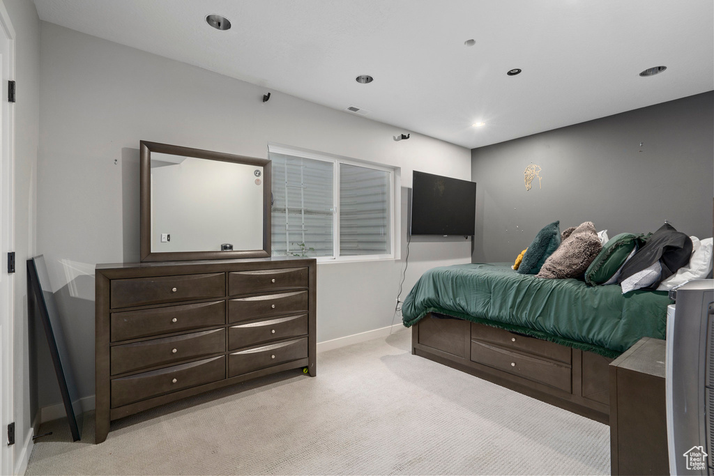 Bedroom with recessed lighting, baseboards, and light carpet
