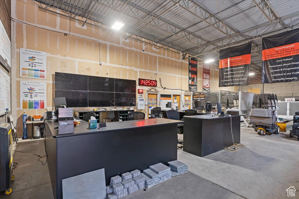 Interior space featuring concrete floors and metal wall
