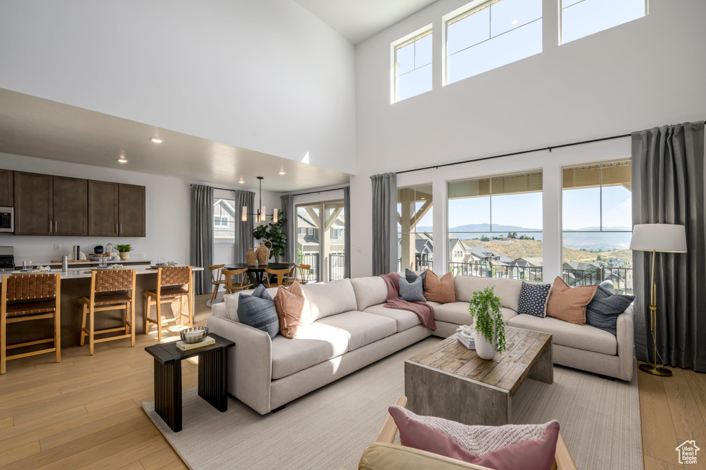 Living area featuring plenty of natural light and light wood finished floors