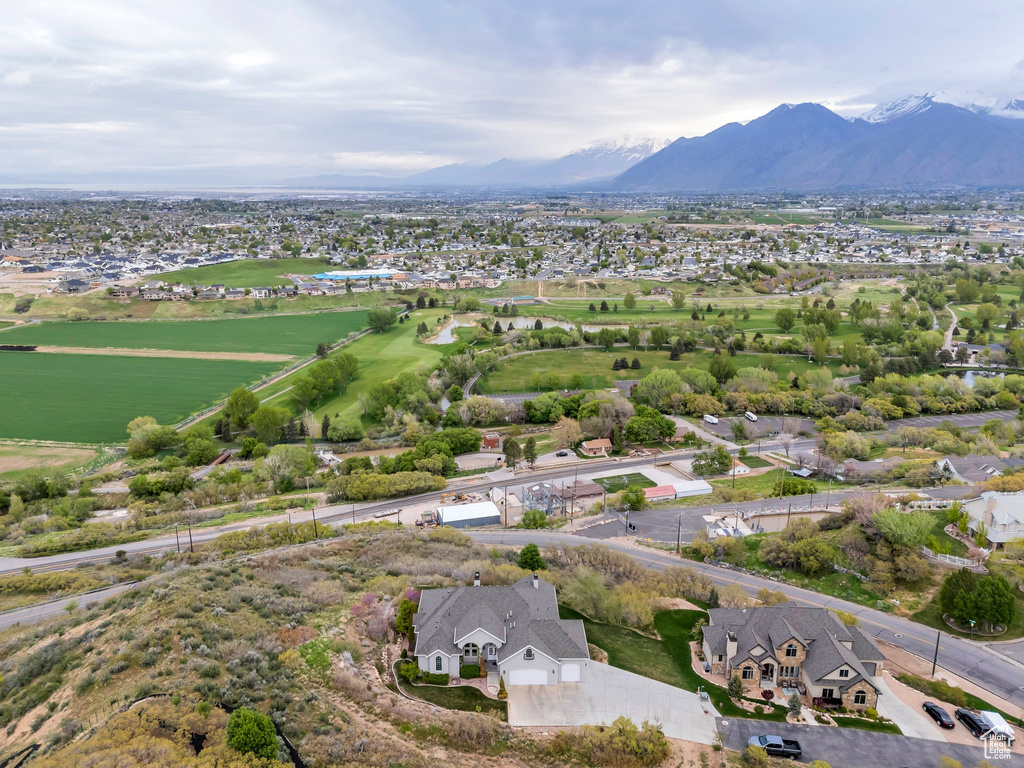 Birds eye view of property with a residential view and a mountain view