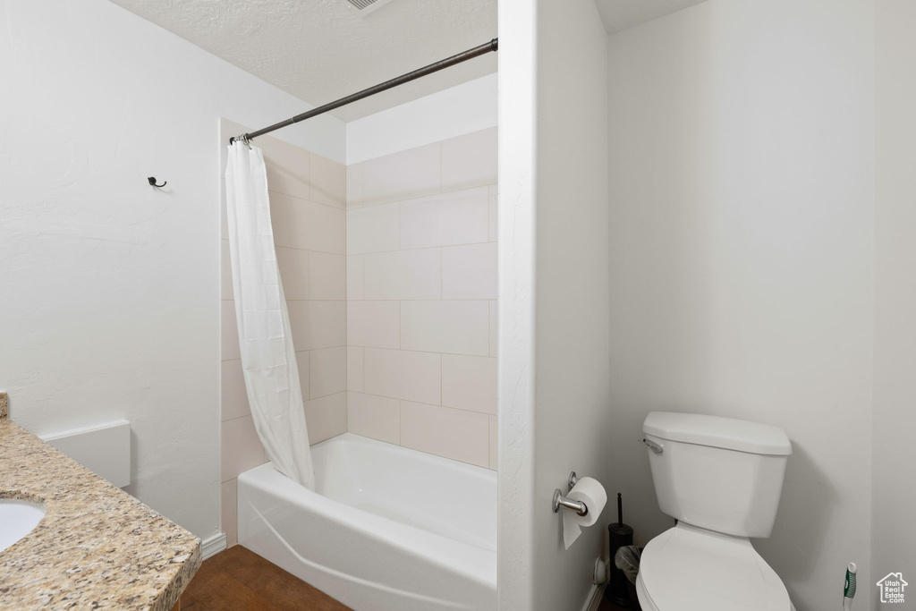 Bathroom featuring shower / bath combo and vanity
