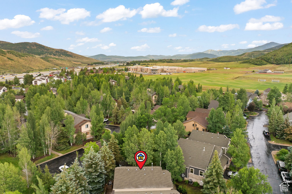 Aerial view of residential area featuring mountains