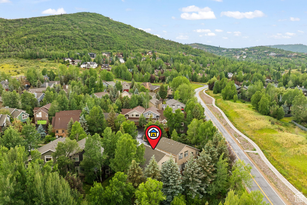 Aerial perspective of suburban area featuring a mountain backdrop