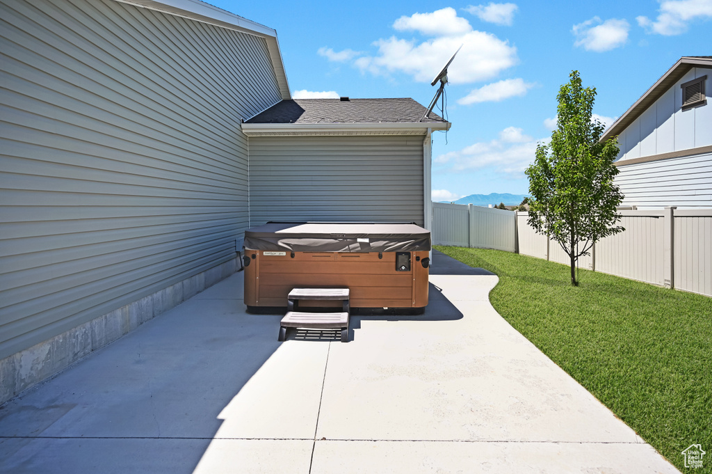 View of patio / terrace featuring a hot tub