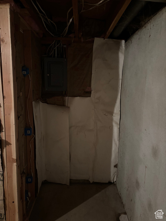 Unfinished basement featuring electric panel