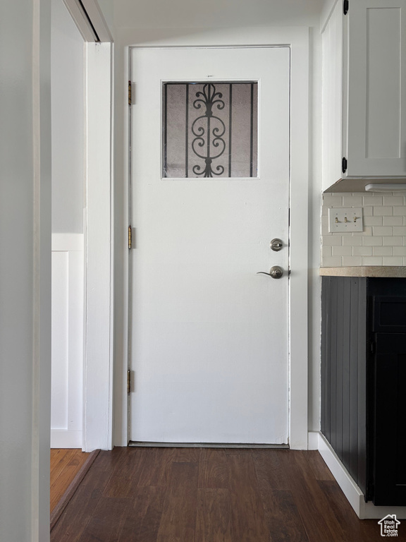 Entryway featuring dark wood-type flooring