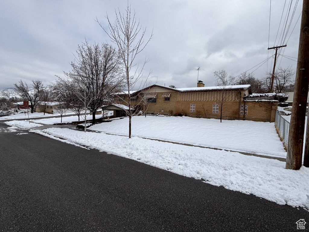 Snowy yard with fence
