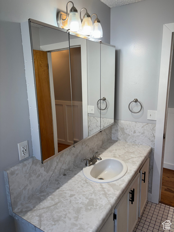 Bathroom featuring vanity and tile patterned flooring