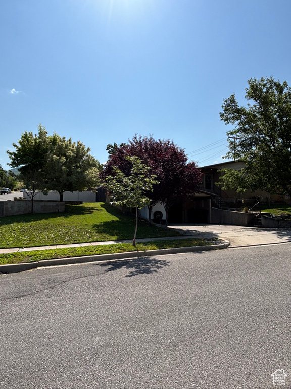 Obstructed view of property featuring driveway
