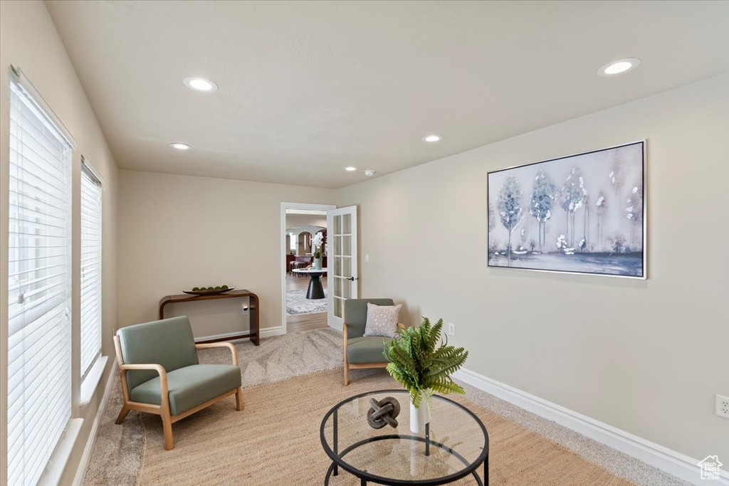 Sitting room with carpet flooring, recessed lighting, french doors, and baseboards