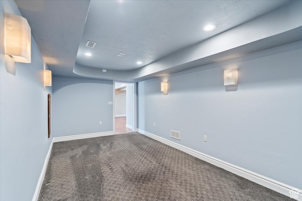 Finished basement featuring recessed lighting, visible vents, carpet flooring, and baseboards