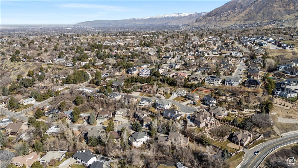 Birds eye view of property with a mountain view and a residential view