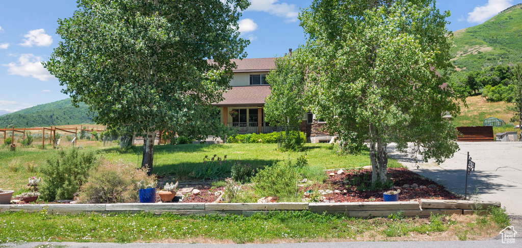 View of front of house featuring a mountain view