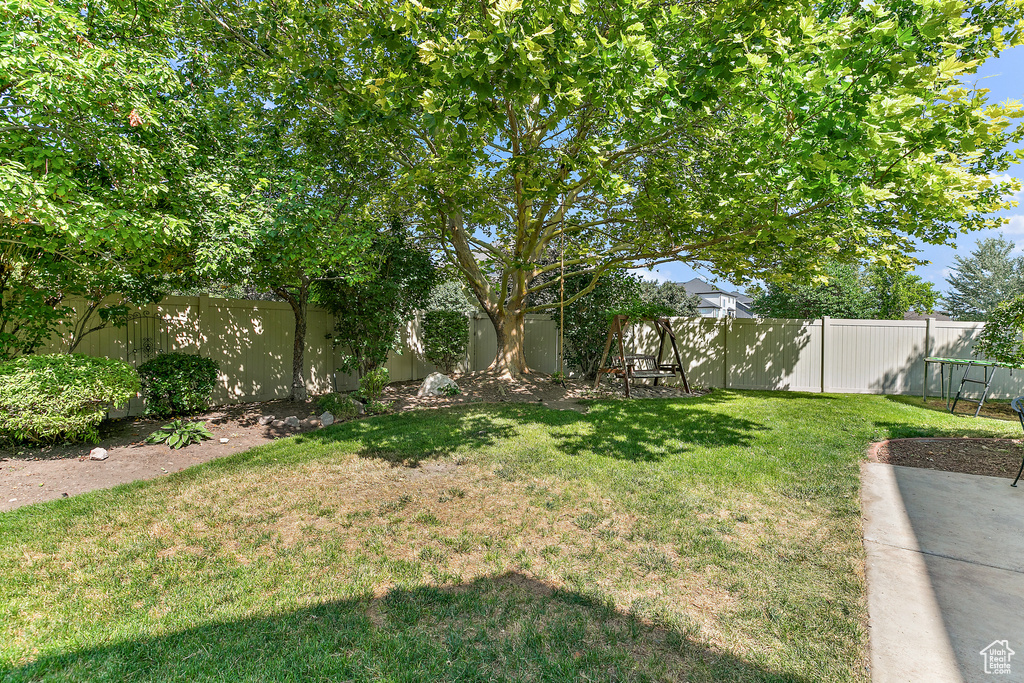 View of yard with a fenced backyard