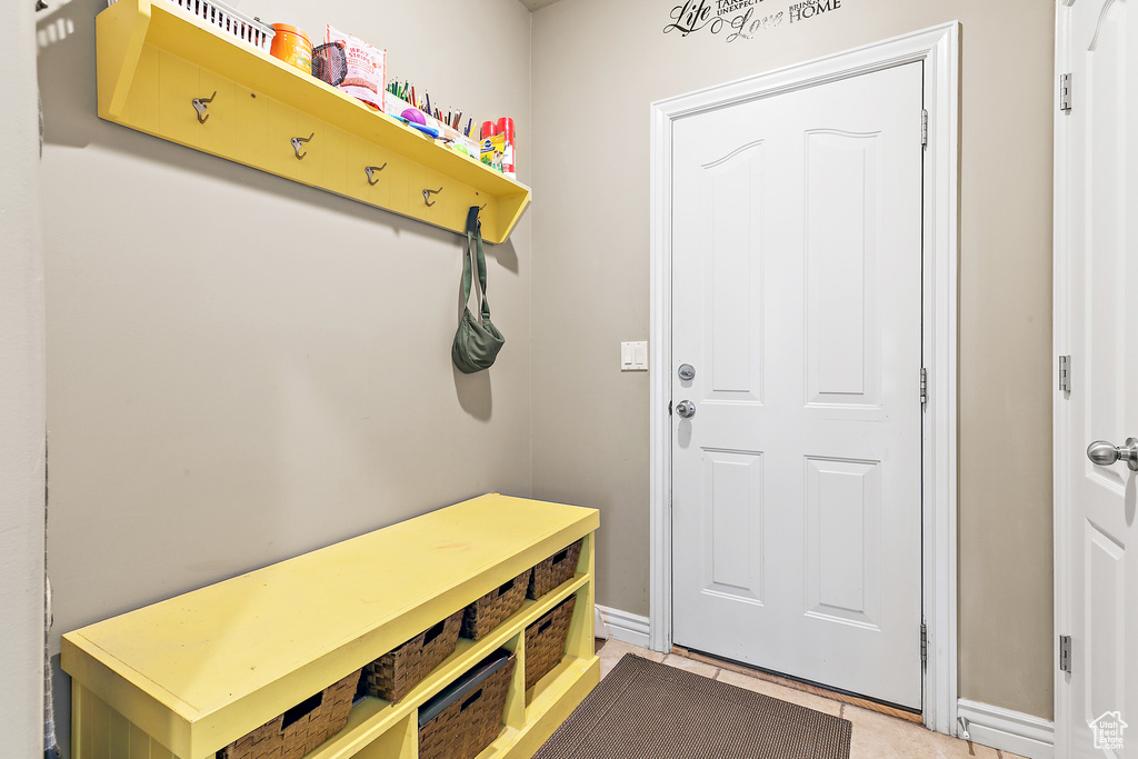 Mudroom featuring light tile patterned flooring