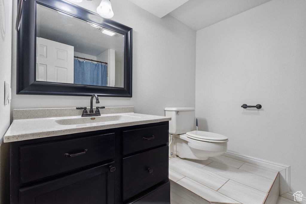 Bathroom with toilet and vanity