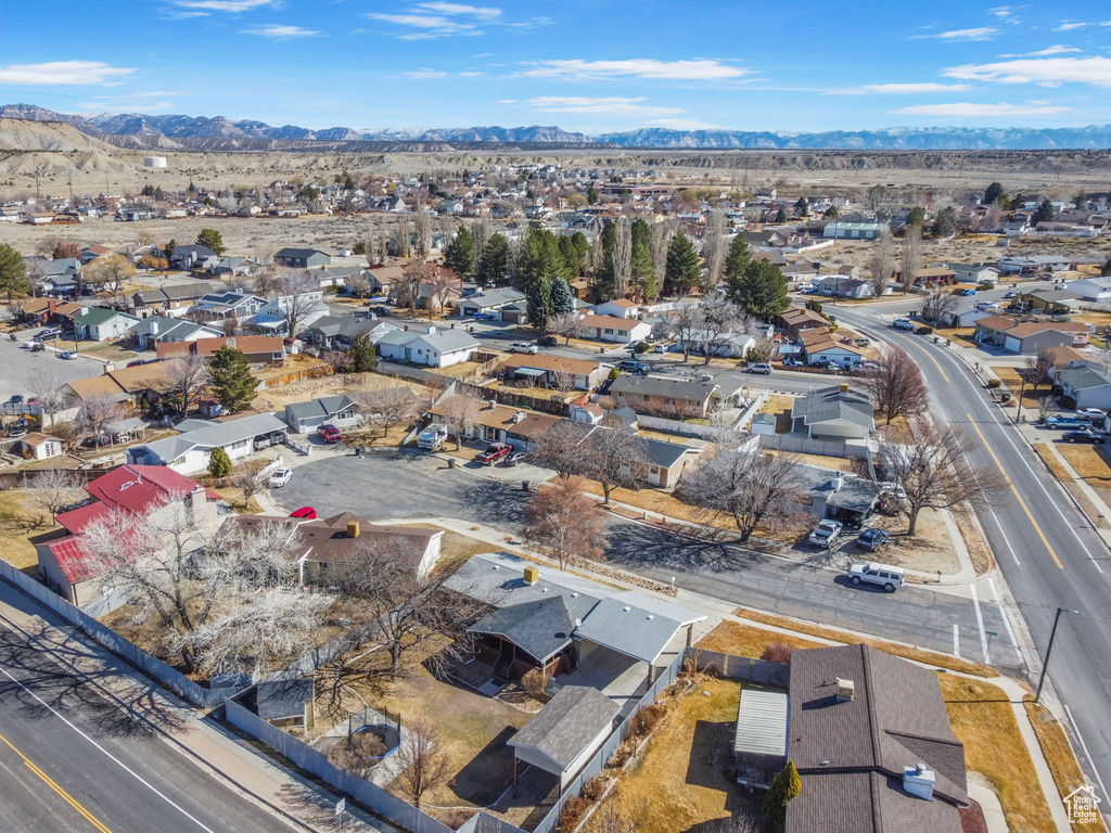 Drone / aerial view featuring a residential view and a mountain view