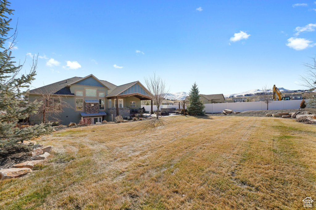 View of yard featuring fence