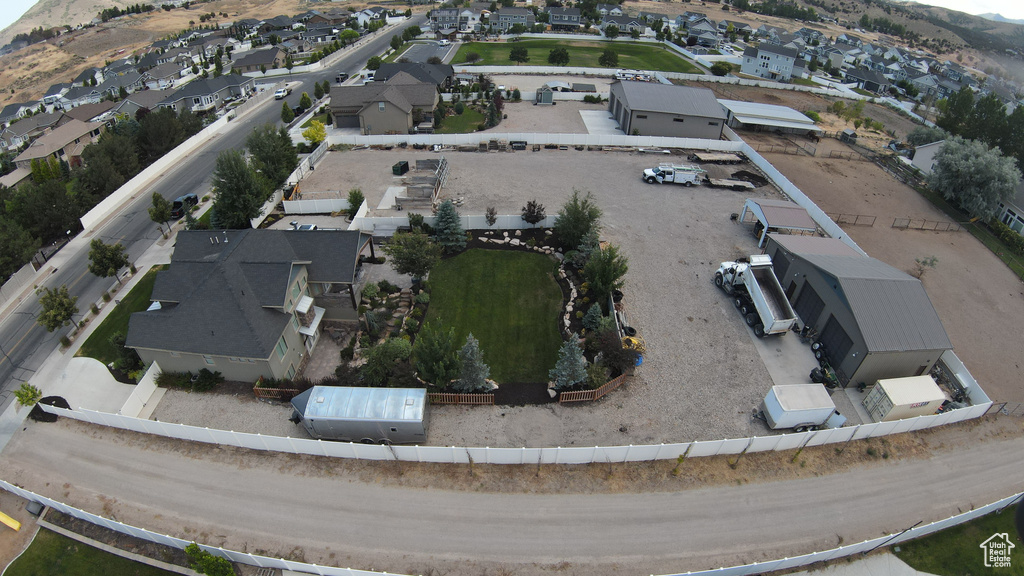 Aerial view of property's location featuring nearby suburban area